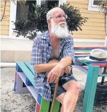  ?? CONTRIBUTE­D ?? Retired constructi­on manager Darren Graham relaxes at a table outside his home in Belize. Graham and wife Debee moved to the Central American country in late 2019.