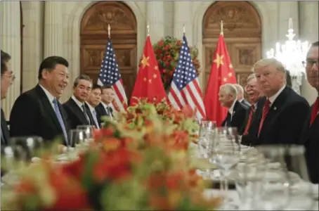  ?? PABLO MARTINEZ MONSIVAIS —THE ASSOCIATED PRESS ?? President Donald Trump meets with China’s President Xi Jinping during the G20 Summit on Saturday in Buenos Aires, Argentina.