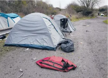  ?? RAFAEL YAGHOBZADE­H/AP ?? A makeshift migrant camp is set up in northern France on Friday. France is seething at Britain’s proposals for dealing with the flow of migrants between the nations.