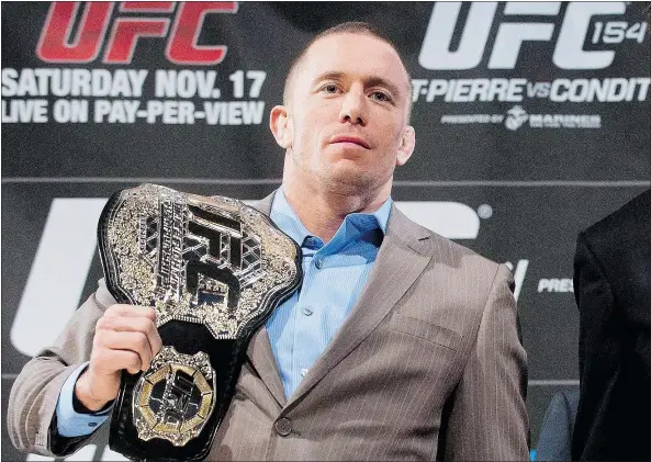  ?? — THE CANADIAN PRESS FILES ?? Georges St-Pierre has been on sabbatical since edging out Johny Hendricks in a hard-fought bout at UFC 167 on Nov. 16, 2013. However, the UFC world is rife with rumours that the Canadian champ may make a return visit to the Octagon.