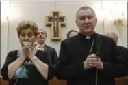  ?? GREGORIO BORGIA — ASSOCIATED PRESS ?? In this Tuesday, July 18, 2016file photo, from left, Mariella Enoc, president of Bambino Gesu Pediatric Hospital, and Cardinal Pietro Parolin, Vatican secretary of state, pray before an event to release the hospital’s annual report at the Vatican....