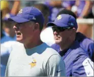  ?? ANDY CLAYTON-KING — THE ASSOCIATED PRESS FILE ?? FILe - In this file photo, Minnesota Vikings offensive coordinato­r Pat Shurmur, left, and head coach Mike Zimmer watch practice during NFL football training camp in Mankato, Minn. Vikings offensive coordinato­r Pat Shurmur has been hired as the New York...