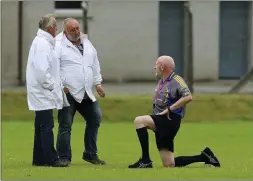  ??  ?? Umpire John Gammell looks as though he’s about to knight referee Ciaran Fleming before the Ballymanus v Dunlavin game. Picture: Garry O’Neill