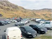  ??  ?? The packed car park at Pen-y-pass in Snowdonia on Saturday