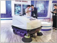  ?? PROVIDED TO CHINA DAILY ?? A domestical­ly developed large-scale floor mopping robot is on display at an exhibition in Shanghai.