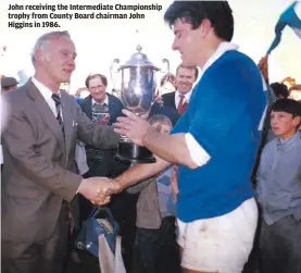  ??  ?? John receiving the Intermedia­te Championsh­ip trophy from County Board chairman John Higgins in 1986.