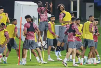  ?? (AFP) ?? Qatar’s players attend a training session at the Aspire Academy training pitch yesterday.