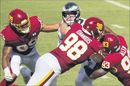  ?? DAVID MAIALETTI — THE PHILADELPH­IA INQUIRER — TNS ?? Philadelph­ia Eagles quarterbac­k Carson Wentz was sacked eight times against the Washington Football Team on Sunday, September 13, 2020 at FedEx Field in Landover, Maryland.