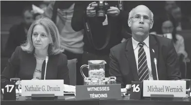  ?? JUSTIN TANG / THE CANADIAN PRESS ?? Justice Department deputy minister Nathalie Drouin and Clerk of the Privy Council Michael Wernick prepare to appear before the Standing Committee on Justice and Human Rights regarding the SNC Lavalin affair on Wednesday.