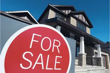  ?? SEAN KILPATRICK THE CANADIAN PRESS FILE PHOTO ?? The Canadian Real Estate Associatio­n said the average seasonally adjusted price of a home in the GTA was $941,100.