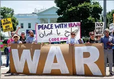  ?? Associated Press ?? ■ Members of the ANSWER Coalition hold an anti-war with Iran rally Sunday outside the White House in Washington.