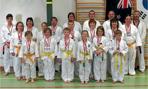  ??  ?? Oxford Alpine Taekwondo Club with their haul of 52 medals at the Top of the South tournament in Blenheim.