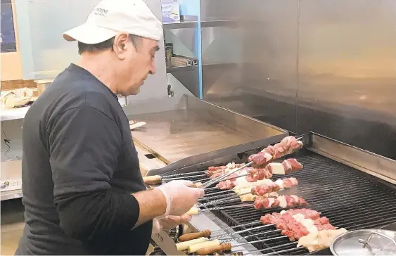  ?? PHOTOS BY RYAN KNELLER/THE MORNING CALL ?? Edmond Hadid works the grill in the newly opened Steel City Gyro at 6900 Hamilton Blvd. in Lower Macungie Township.