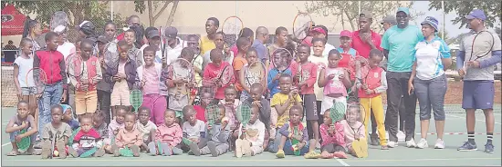  ?? (Pic: Nimrod Hlophe) ?? Kenyan tennis expert Oketch George (3rd R) with some participan­ts of the tennis festival held by on Saturday by Eswatini Olympic and Commonweal­th Games Associatio­n (EOCGA). Also in the image are some of the Developmen­t of National Sports Structures programme beneficiar­ies from the Eswatini Tennis Associatio­n.