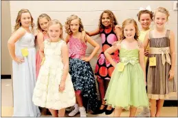  ?? PHOTOS BY LYNN KUTTER ENTERPRISE-LEADER ?? Pageant girls in the 8-9 year-old division of the Miss Clothespin pageant wait their turn to go on stage. Contestant­s were Elise Pinkerton, left, of Fayettevil­le, Madyson Pease of Lincoln, Kassidy Cuzick of Lincoln, Kennedy Ryan of Farmington, Addison...