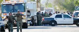  ??  ?? PALM SPRINGS: Riverside County Sheriffs Deputies stand near the scene of a shooting on Saturday. — AP