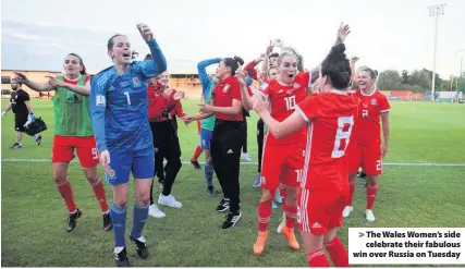  ??  ?? &gt; The Wales Women’s side celebrate their fabulous win over Russia on Tuesday