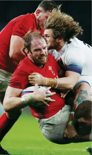  ??  ?? Giving his all: Alun Wyn Jones in action against England