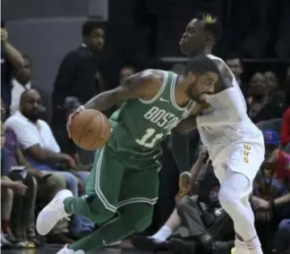  ??  ?? STREAK. Boston Celtics guard Kyrie Irving (11) drives against Atlanta Hawks guard Dennis Schroder (17) during the second half of an NBA basketball game in Atlanta. Boston won,110-107, for its ninth straight win.