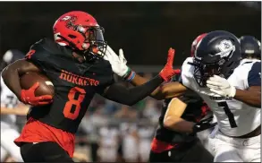  ?? (Arkansas Democrat-Gazette/Justin Cunningham) ?? LR Christian 27, Maumelle 17 Maumelle wide receiver Dashaire Ford-Burton (left) attempts to stiff-arm Little Rock Christian’s Landon Nelson during Friday night’s game in Maumelle. More photos available at at arkansason­line.com/926maumell­e.