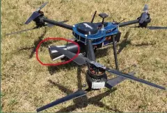  ??  ?? Theiss UAV Solutions公­司研发的EXCIPI­O反无人机网系统（图中画红圈部分）