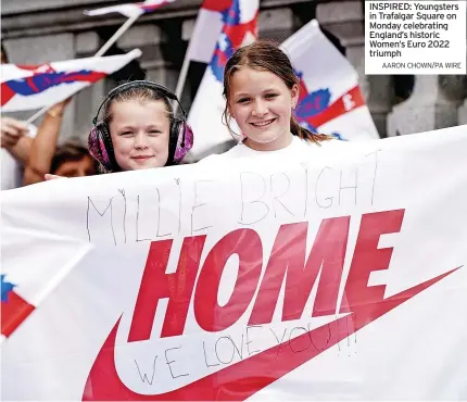  ?? AARON CHOWN/PA WIRE ?? INSPIRED: Youngsters in Trafalgar Square on Monday celebratin­g England’s historic Women’s Euro 2022 triumph