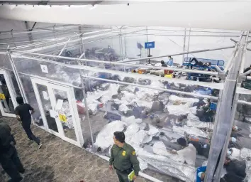  ?? DARIO LOPEZ-MILLS/AP ?? Minors rest inside a pod at the Donna Department of Homeland Security holding facility March 30 in Donna, Texas. More Americans disapprove of how President Joe Biden’s administra­tion is handling the waves of immigratio­n.