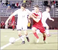  ?? Graham Thomas/Herald-Leader ?? Siloam Springs senior Francisco Sifuentes holds off a Fort Gibson defender during the championsh­ip game of the Panther Classic on Saturday at Panther Stadium. Fort Gibson defeated Siloam Springs 3-2 to win the tournament title.