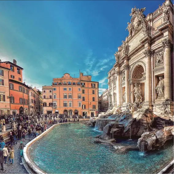  ?? Brian LoPiccolo / Getty Images ?? Tradition holds that if travelers toss a coin in the Trevi Fountain, they will find their way back to Rome.