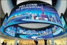  ?? LIU XIN / FOR CHINA DAILY ?? People visit the upgraded Shanghai Urban Planning Exhibition Hall in Shanghai on Feb 22. The venue, a window showcasing the city’s developmen­t, was closed for renovation and technologi­cal upgrades at the end of 2019 and reopened for trial operation on Feb 19.