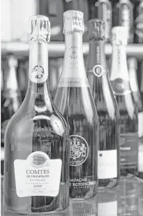  ?? Michael Ciaglo photos / Houston Chronicle ?? 2006 Taittinger Comtes de Champagne Blanc de Blancs, from front, Barons de Rothschild Blanc de Blancs NV, Castelnau Brut Reserve NV and Abel Charlot NV