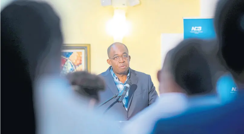  ?? GLADSTONE TAYLOR/MULTIMEDIA PHOTO EDITOR ?? President and CEO of NCB Financial Group Limited, Patrick Hylton, is framed by analysts and other participan­ts at the banking group’s investor briefing on its third-quarter results for June 2019, held at the NCB Wellness and Recreation Centre in New Kingston on Friday, July 26, 2019.