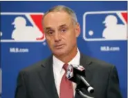  ?? CHARLES REX ARBOGAST — THE ASSOCIATED PRESS ?? Baseball Commission­er Rob Manfred listens to a question following the two-day meeting of Major League Baseball owners, Thursday in Chicago.