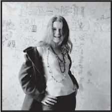  ?? IMAGES: HAIGHT STREET ARTS CENTER ?? Herb Greene snapped this photograph of singer Janis Joplin in front of his San Francisco apartment's “hieroglyph­ics wall.” The photo is part of a new Haight Street Arts Center exhibit devoted to the music photograph­er.