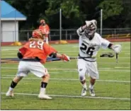  ?? AUSTIN HERTZOG - DIGITAL FIRST MEDIA ?? Spring-Ford’s Gavin Hare (26) works his way around the defense of Perkiomen Valley’s Connor Donovan (29) during Thursday’s game.