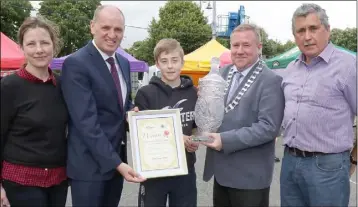  ??  ?? Alex Fortune (13), Ballyhogue, from Fortune’s Fruit and Veg, winner of the All-Ireland Farmer’s Market. He was presented with his prize by Liz Hore, Minister Paul Kehoe TD, Cllr. Keith Doyle, chairman Enniscorth­y Municipal District, and Pat Roche,...