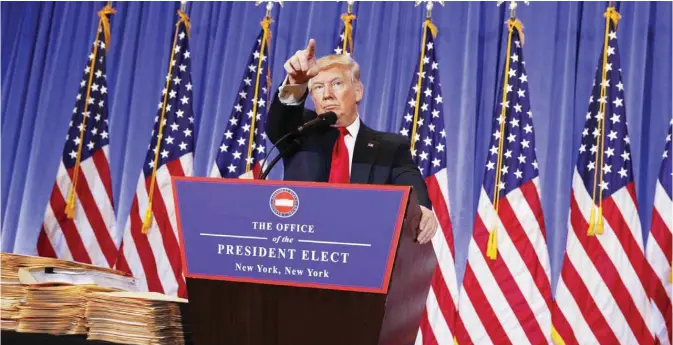  ??  ?? NEW YORK: President-elect Donald Trump calls on a reporter during a news conference in the lobby of Trump Tower. —AP