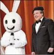  ?? GREG GAYNE/ABC ?? RIGHT: Now: Tommy Maitland (Mike Myers, right) and Snax the Funny Bunny on “The Gong Show.”