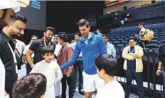  ?? ?? Novak Djokovic meets young fans.