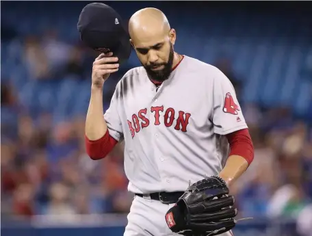  ?? GETTY IMAGES ?? KEEP IT BRIEF: David Price heads to the dugout after retiring the side in order in the fifth inning of the Red Sox’ 12-2 win against the Blue Jays yesterday in Toronto.