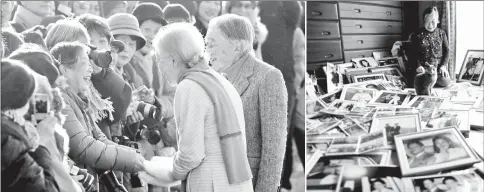  ?? — Reuters photos ?? (Left) Fumiko Shirataki shakes hands with Japan’s Empress Michiko. • (Right) Fumiko Shirataki displays her collection of photos of royal family members.