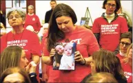  ?? Christian Abraham / Hearst Connecticu­t Media ?? Erin Bond, of Bethel, holds a photo of her neice Emily Todd, who was murdered in 2018 during a special state-wide event hosted by Moms Demand Action for Gun Sense in America at the Margaret Morton Government Center in downtown Bridgeport on Feb. 8.