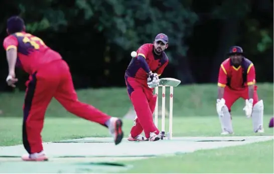  ?? —AFP ?? FRANKFURT: Afghan cricket player Hamid Wardak plays a ball during an A vs B match.