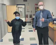  ??  ?? The director of education Marc Bertrand with Sarah Donatien, student in a special education class at the Collège catholique
Samuel-Genest.