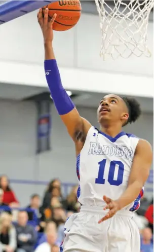  ?? STAFF FILE PHOTO ?? Cleveland’s JaCobi Wood puts up a layup during the Blue Raiders’ Class AAA state sectional win over Blackman on March 4, 2019, He was a state Mr. Basketball this year.