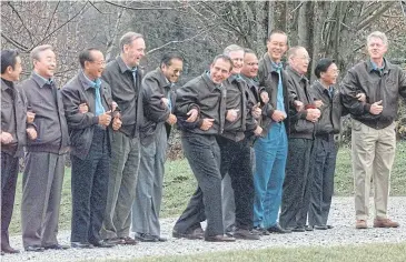  ?? AP ?? Former New Zealand prime minister Jim Bolger, sixth from right, joins Apec leaders for a group photo in Vancouver, Canada in 1997. At second right is former Thai prime minister Chuan Leekpai.