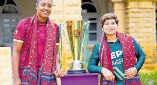  ?? CWI PHOTO ?? West Indies Women’s captain Hayley Matthews (left) and Pakistan skipper Nida Dar pose with the trophy up for grabs in an ODI series between the teams at the Quaid-e-Azam House recently.