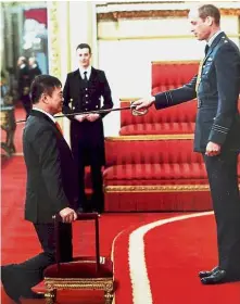  ??  ?? Priceless honour: Poh being knighted by Prince William during the ceremony.