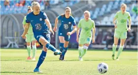  ??  ?? Opener: Striker Pernille Harder scores Chelsea’s first goal from the penalty spot in Budapest