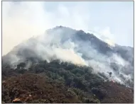  ?? PHOTO VIA CALFIRE ?? This Tuesday Photo shows the Pier Fire which is still burning uncontaine­d in the Tule River Canyon.